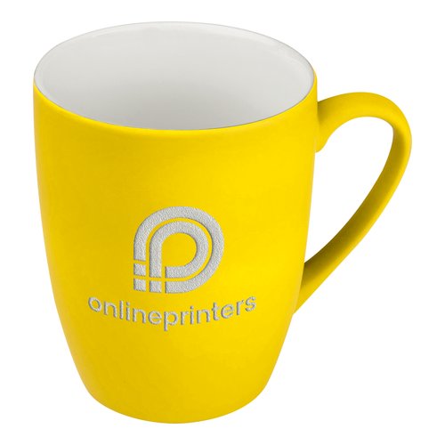Gelbe Keramiktasse mit Henkel.
